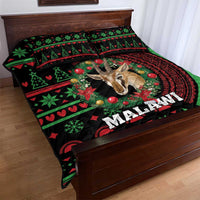 Malawi Christmas quilt bed set spread on wooden bed, gazelle motif in black/green/red