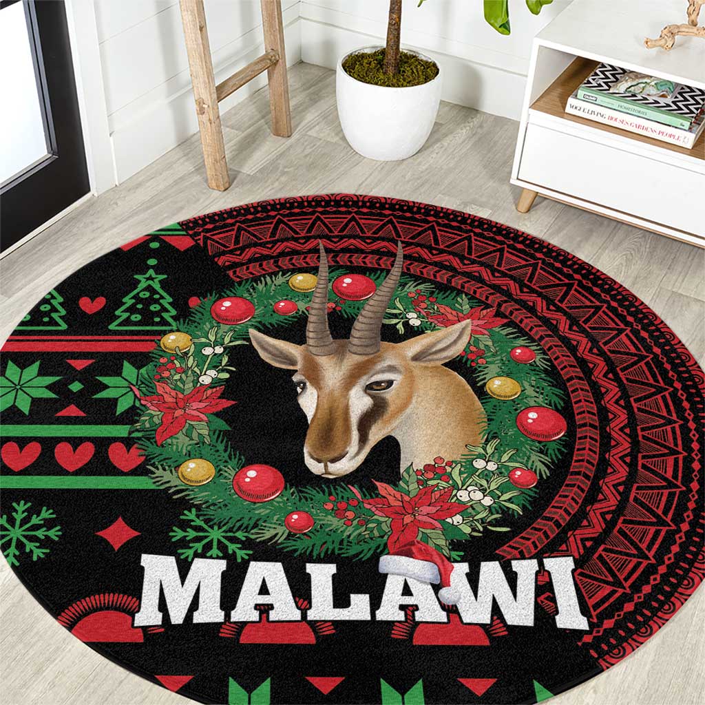 Round rug close-up, black/red/green Malawi text with gazelle and patterned border