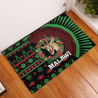 Christmas rubber doormat with black, green and red Malawi pattern, gazelle graphic