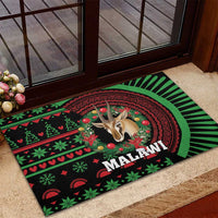 Christmas rubber doormat with Malawi text, gazelle head, green/red festive pattern