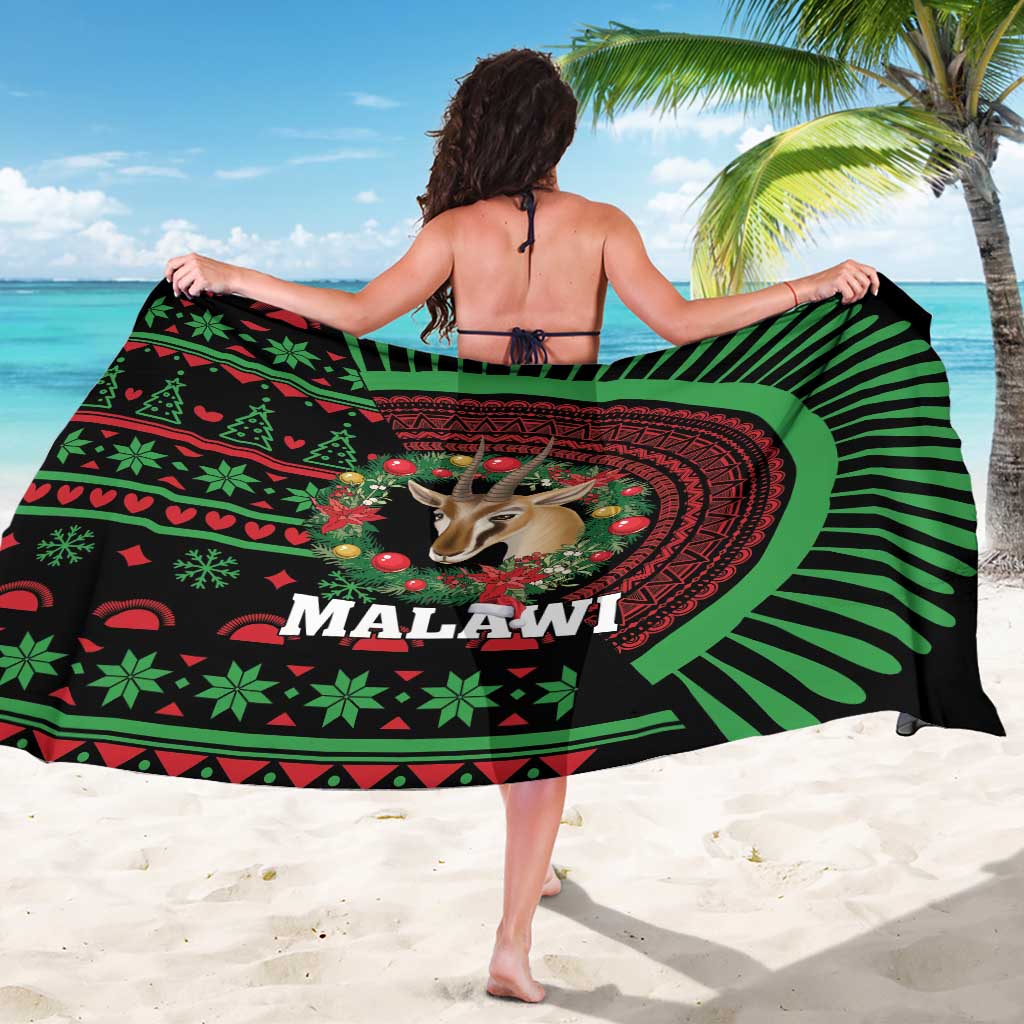 Christmas sarong spread wide: black and green striped rays with gazelle and “MALAWI”