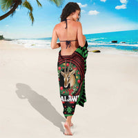 Christmas sarong in black, green, and red with gazelle graphic and “MALAWI” text