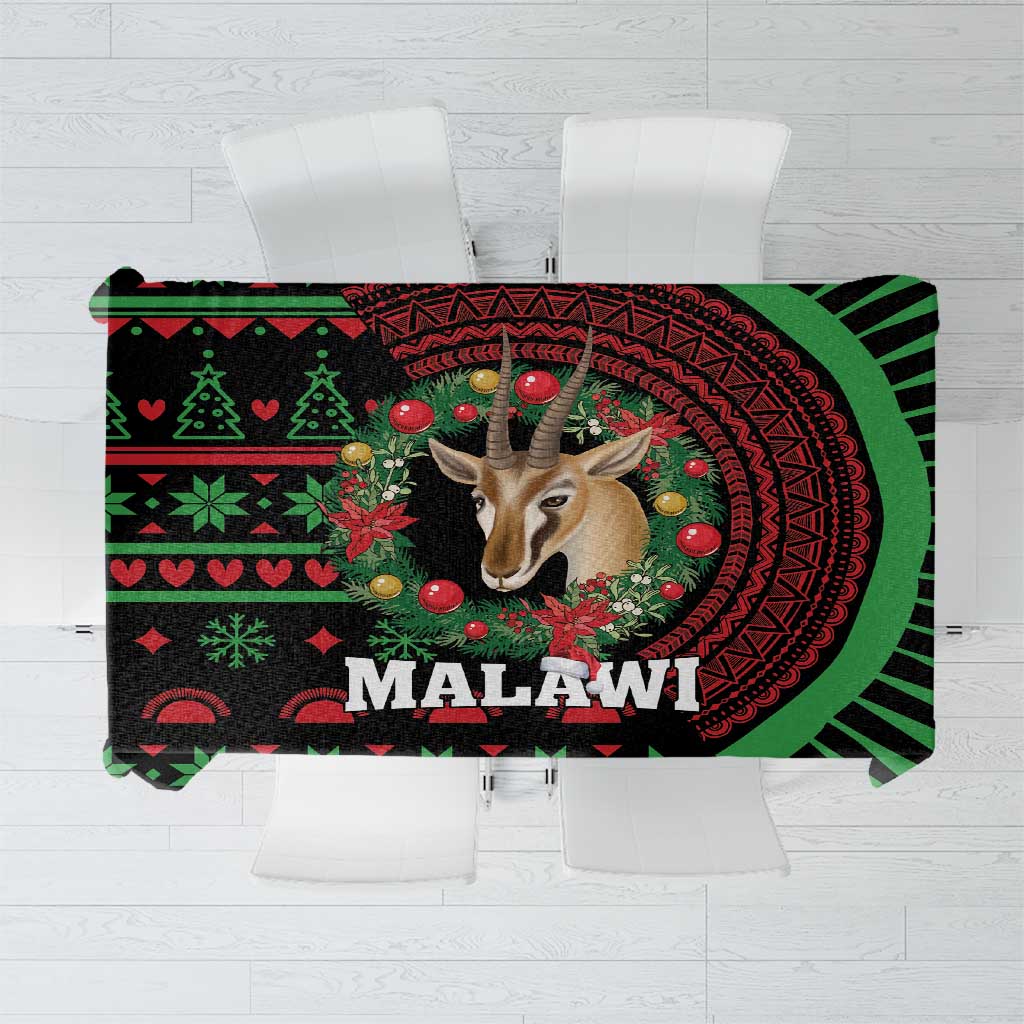 Christmas tablecloth, black and green circular motif with 'MALAWI' text and reindeer