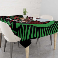 Christmas tablecloth with black base, green and red African pattern, table draped corner