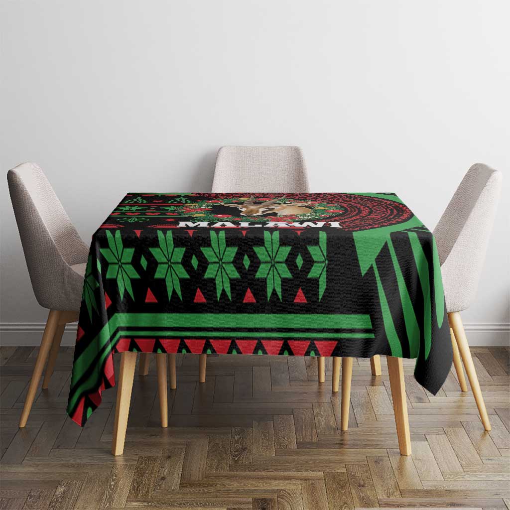 Christmas tablecloth on table with black base, green geometric and stripe pattern