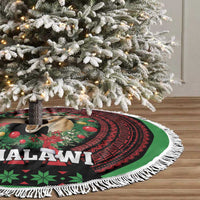 Round Christmas tree skirt with white tassel fringe and green-red tribal deer pattern