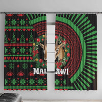 Black curtain pair with green/red African holiday pattern, deer portrait and round sunburst detail