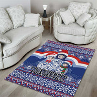 Christmas area rug with blue Santa and matryoshka dolls, geometric trim, bold border
