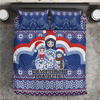 Blue duvet cover with matryoshka Santa doll print, red/white/blue border and festive lettering