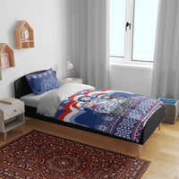 Blue Christmas bedding set with matryoshka Santa doll print, includes duvet and pillow