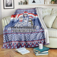 Blue Christmas blanket with Santa and matryoshka dolls, large central graphic and border trim