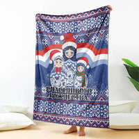 Blue Christmas blanket with Santa and matryoshka dolls, vertically draped sofa throw