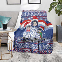 Blue Christmas throw blanket with Santa and matryoshka dolls, cloud scene and festive stripes