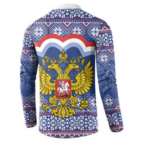 Blue back button sweatshirt with ornate coat of arms graphic and winter border pattern
