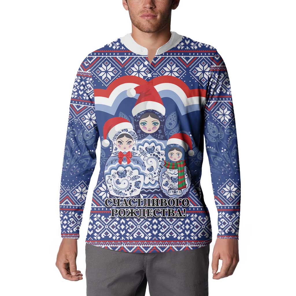 Blue button-front sweatshirt worn by model, featuring matryoshka dolls holiday graphic