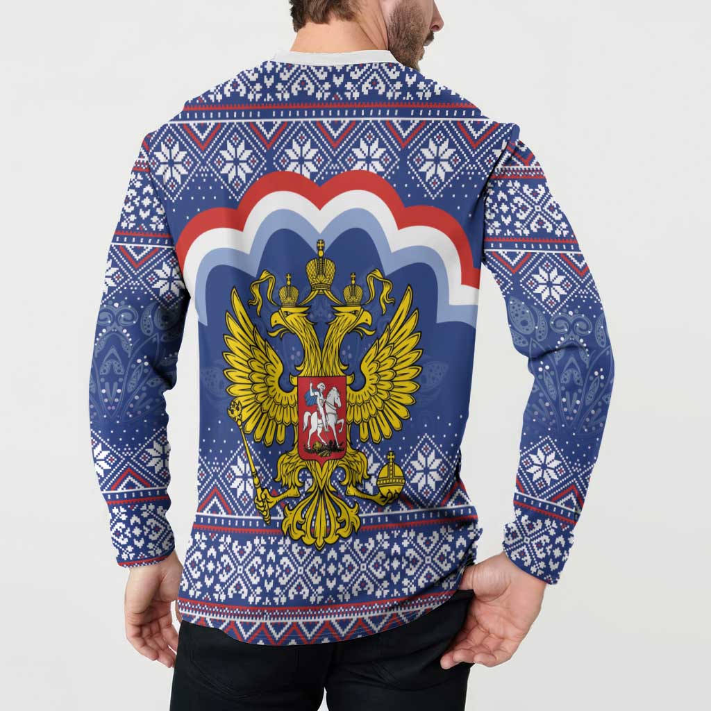 Blue back button sweatshirt on model, showing coat of arms graphic over festive pattern