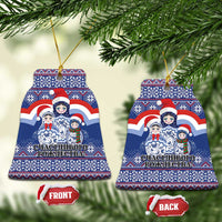 Blue ceramic bell-shaped Christmas ornament with matryoshka Santa figures, gold hanging loop