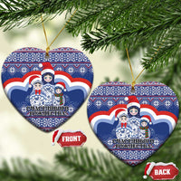 Blue ceramic heart-shaped Christmas ornament with matryoshka Santa figures, gold hanging loop