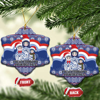 Blue ceramic star-shaped Christmas ornament with matryoshka Santa figures, gold hanging loop