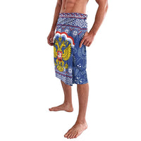 Blue patterned lavalava wrap skirt with winged holiday figure graphic on side