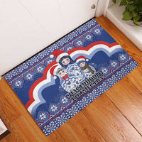 Blue rubber doormat with matryoshka dolls and snowy cloud artwork, bordered by patterns