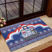Blue outdoor rubber doormat with matryoshka dolls, Santa hats, and festive border design