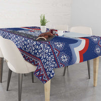 Blue Christmas tablecloth with red and white curved motif and geometric patterns.