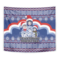 Blue square tapestry with Santa hat matryoshka figures, snowcloud center, and border.