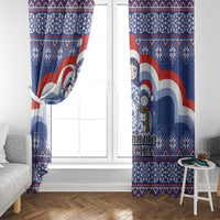 Blue matryoshka Santa Christmas curtain panel with tie-back at a window