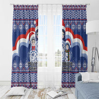 Blue Christmas curtain pair with matryoshka Santa artwork, sheer center window view