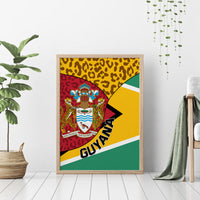 Wood-framed Guyana canvas wall art with coat of arms, leopard print, and flag stripes.