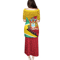 Back-view tunic dress with crest graphic, leopard print yellow top and red skirt