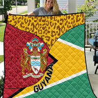 Guyana quilt blanket with leopard pattern, crest emblem, and diagonal tricolor stripes