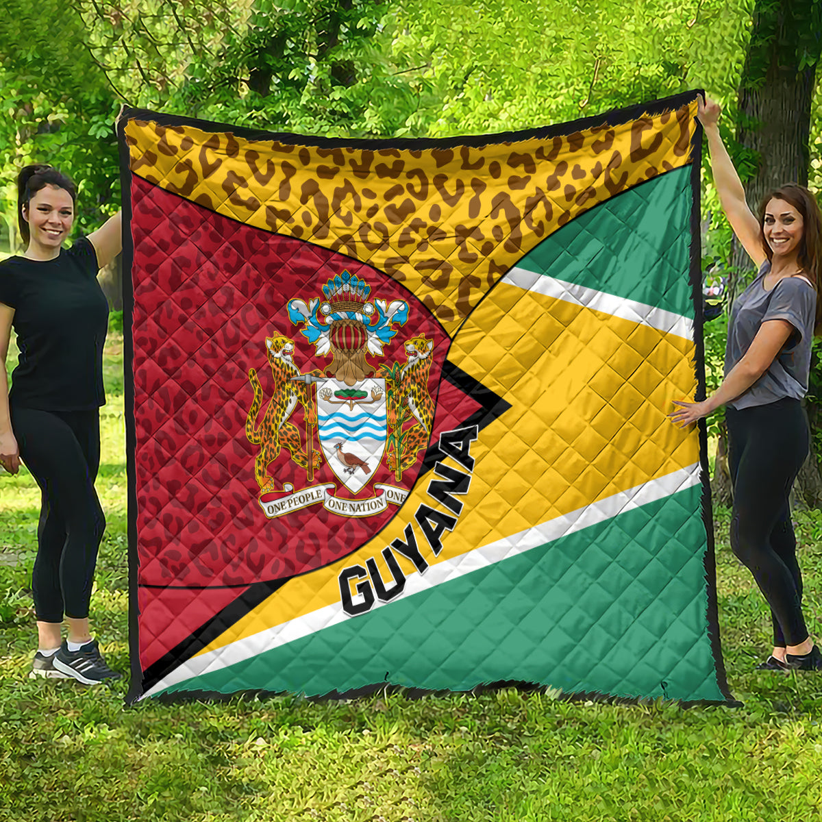 Guyana quilt blanket with crest emblem, leopard top band, and tricolor flag design