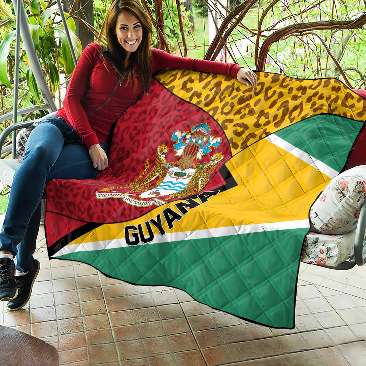 Guyana quilt blanket with leopard pattern, crest emblem center, and diagonal tricolor stripes