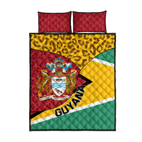 Guyana quilt bed set with coat of arms and leopard print; red, yellow, green, with two matching pillows.