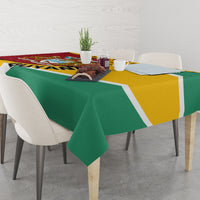 Guyana Republic Day tablecloth draped over table, green and yellow blocks with leopard panel.