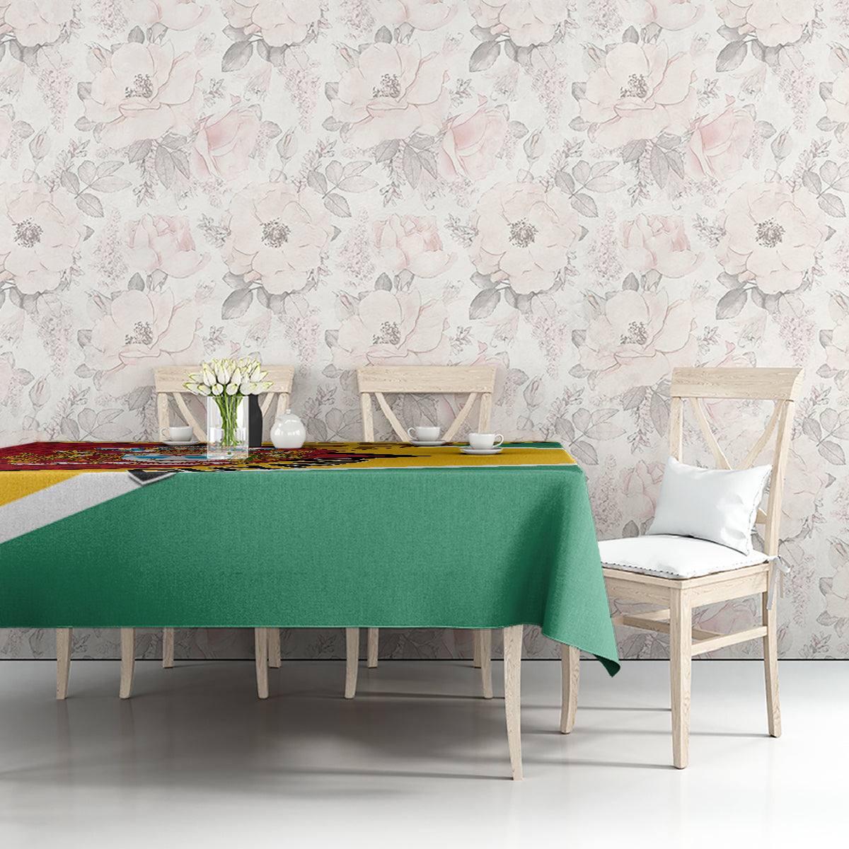 Guyana Republic Day tablecloth with green drape and multicolor crest panel along the edge.