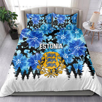 Blue duvet cover and pillowcases for Estonia, with crest, floral bursts and pine silhouettes