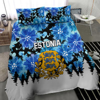 Blue Estonia bedding set featuring floral burst print, gold crest, and pine forest
