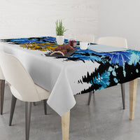 Blue tablecloth with cornflower floral pattern and yellow-and-blue crest