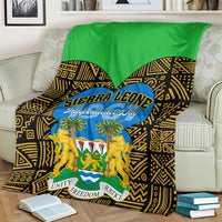 Sierra Leone Independence Day blanket on sofa, green-and-black zigzag pattern with lions emblem