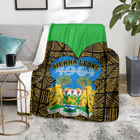 Sierra Leone Independence Day blanket on floor, green top with black-gold geometric lions emblem