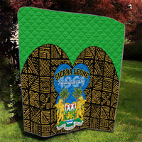 Green quilt with diamond quilting texture, yellow and black design, blue Sierra Leone Independence Day circle