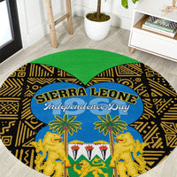 Round carpet with black-and-gold African pattern, green center, blue Independence Day oval