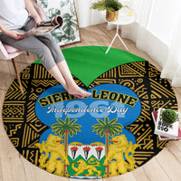 Round carpet with black-and-gold geometric design, green top, blue Sierra Leone Independence Day oval