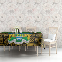 Tablecloth with black-and-gold African motifs, green border, and central unity freedom justice