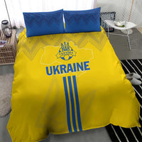 Yellow bedding set with UKRAINE print and blue stripes, plus two blue patterned pillowcases