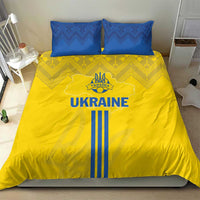 Yellow duvet with UKRAINE graphic and blue vertical stripes, paired with two blue pillows