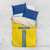Yellow and blue Ukraine bedding set with UKRAINE text and two blue pillowcases